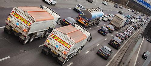 two tipper truck lorries on busy M25 