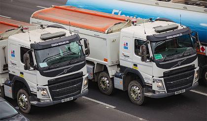 two tipper truck lorries on motorway